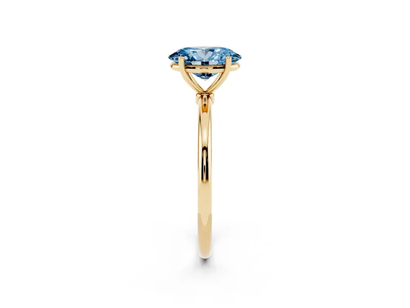 Fancy Blue Oval Cut Diamond Solitaire Engagement Ring Set in Yellow gold with Thin Band and Prong Setting