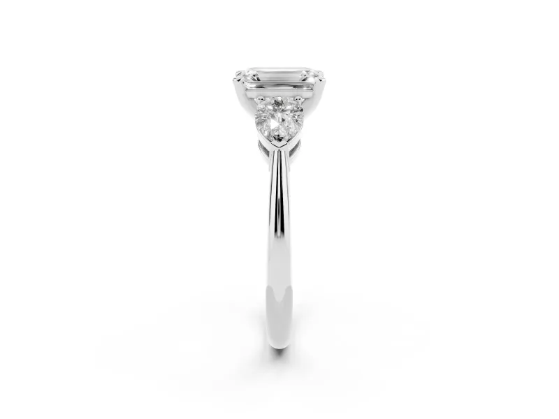 Three-Stone Emerald Cut Diamond Ring Set in White gold with Pear Side Stones and Prong Setting