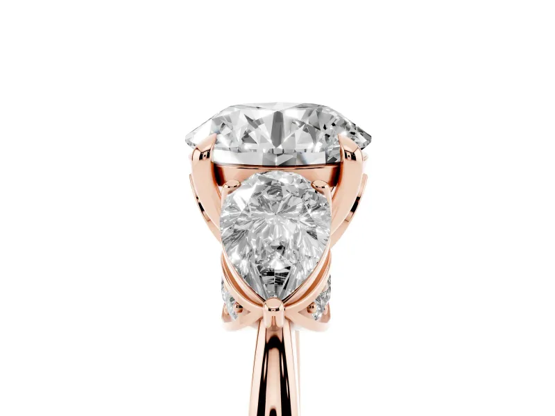 Round Cut Diamond Three-Stone Ring Set in Rose gold with Pear Side Stones