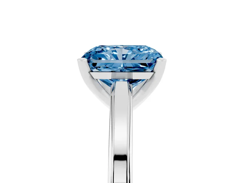 Fancy Blue Radiant Cut Diamond Solitaire Ring Set in Platinum with Prong Setting and Classic Band