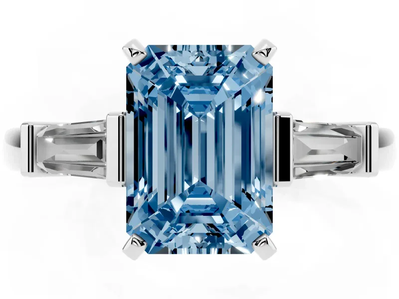 Fancy Blue Emerald Cut Diamond Solitaire Ring Set in Silver with Tapered Baguette Accents and Prong Setting