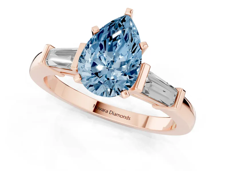 Fancy Blue Pear Cut Diamond Solitaire Ring Set in Rose gold with Tapered Baguette Accents and Prong Setting