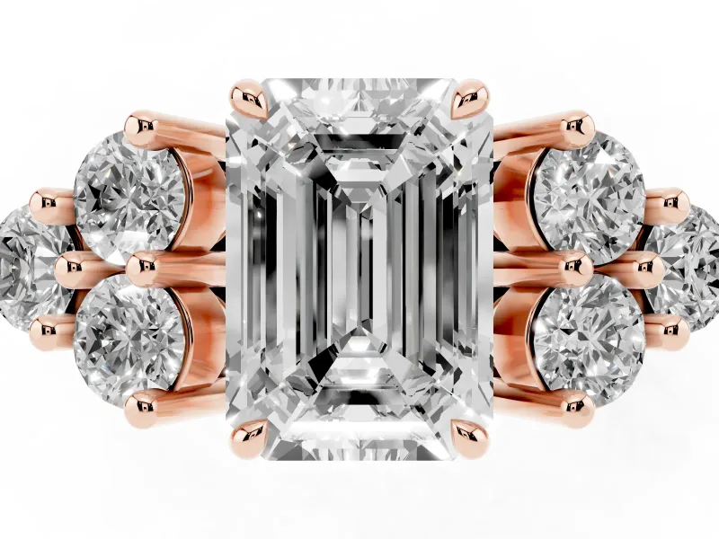 Emerald Cut Diamond Solitaire Ring Set in Rose gold with Cluster Accents on Each Side