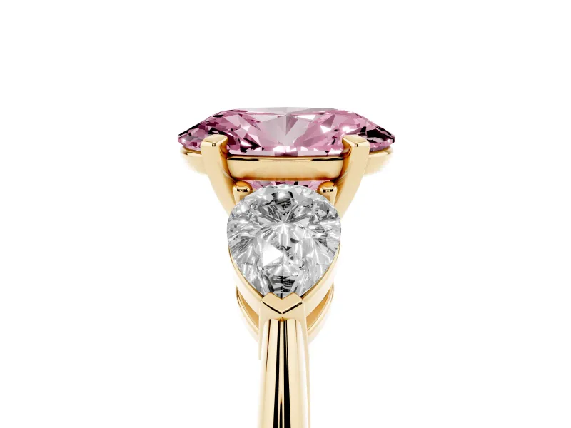 Fancy Pink Three-Stone Oval Cut Diamond Ring Set in Yellow gold with Pear Side Stones and Prong Setting