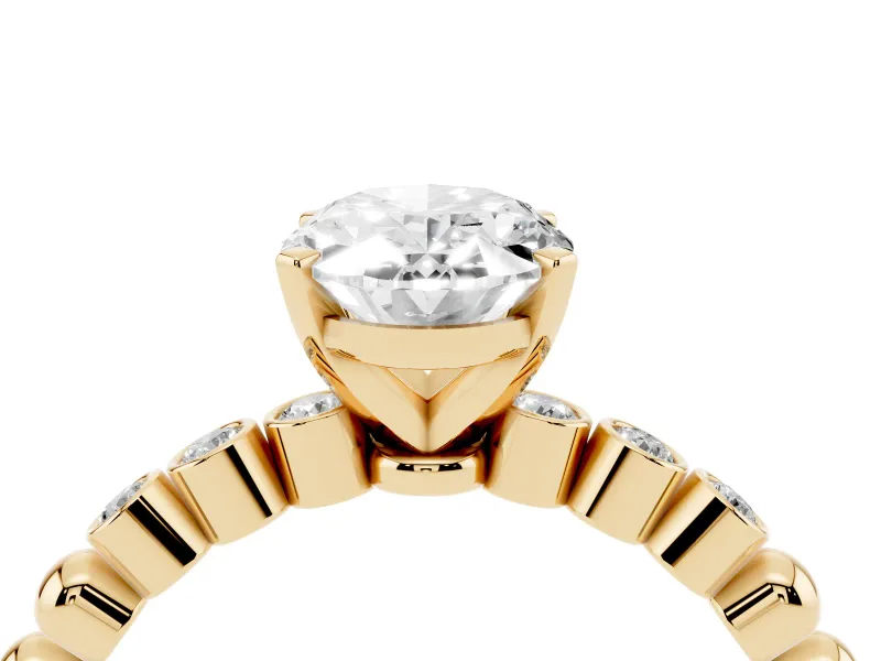 Oval Cut Diamond Solitaire Engagement Ring Set in Yellow gold with Bezel Accents on Beaded Band