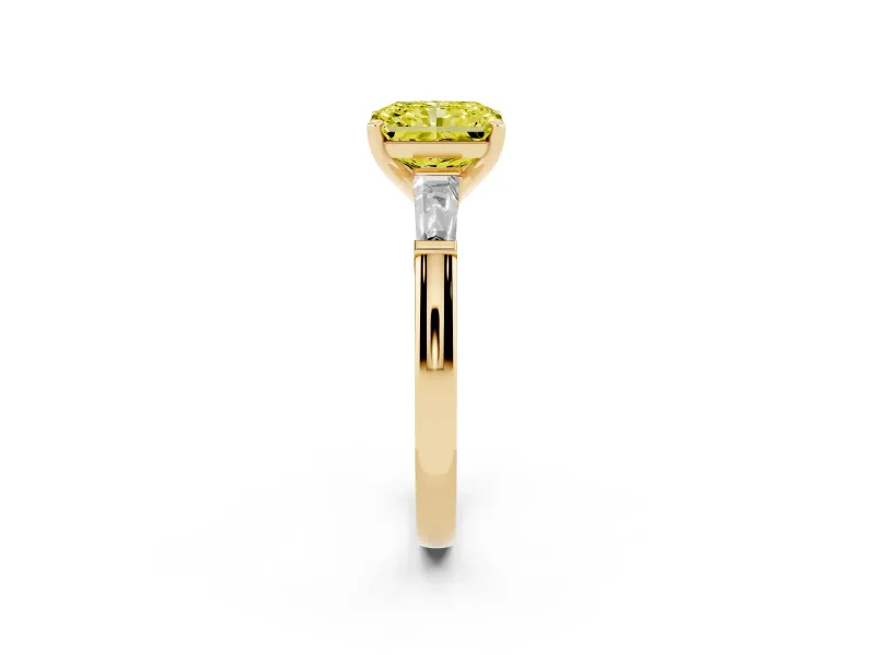 Fancy Yellow Radiant Cut Diamond Solitaire Ring Set in Yellow gold with Tapered Baguette Side Stones and Prong Setting