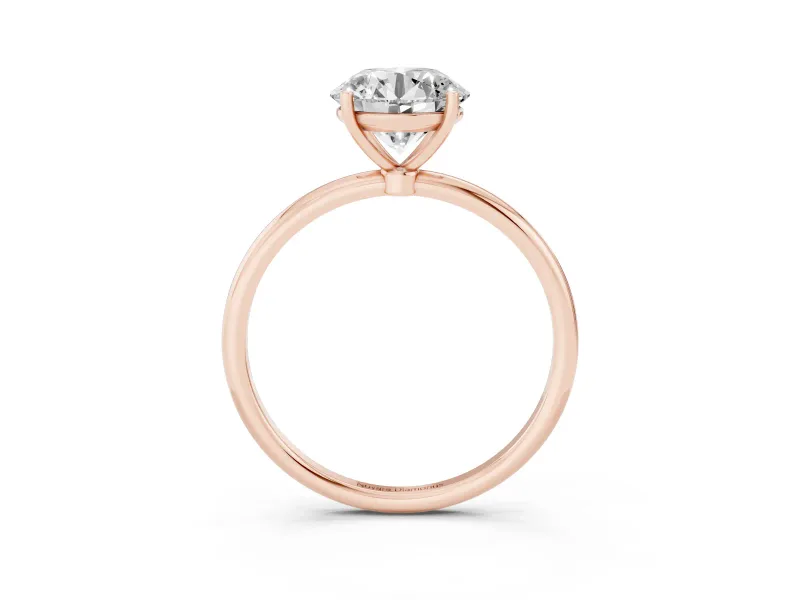 Round Cut Diamond Solitaire Engagement Ring Set in Rose gold with Thin Band and Prong Setting