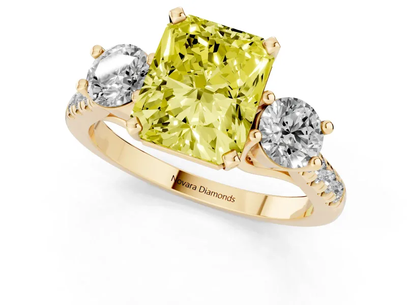 Fancy Yellow Three-Stone Radiant Cut Diamond Pavé Band Ring Set in Yellow gold with Prong-Set Trio