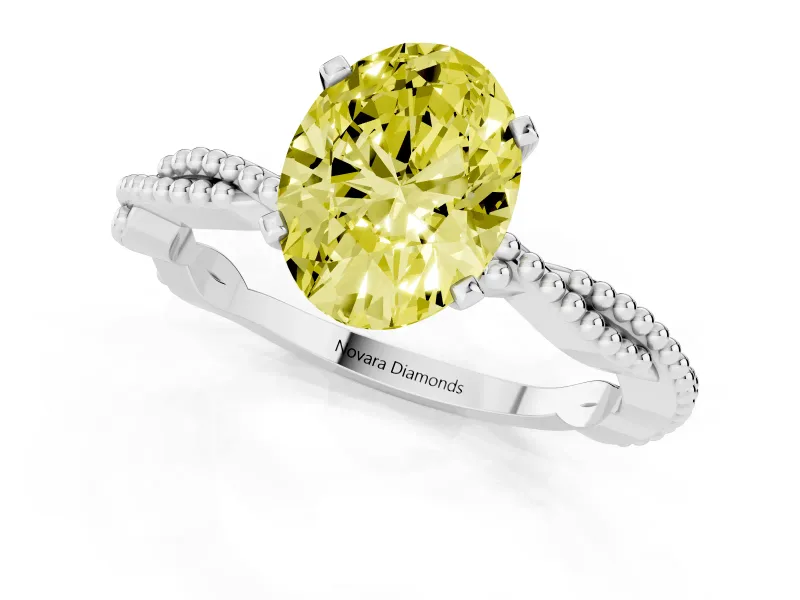 Fancy Yellow Oval Cut Diamond Solitaire Ring Set in Platinum with Twisted Band and Bead Prong Setting