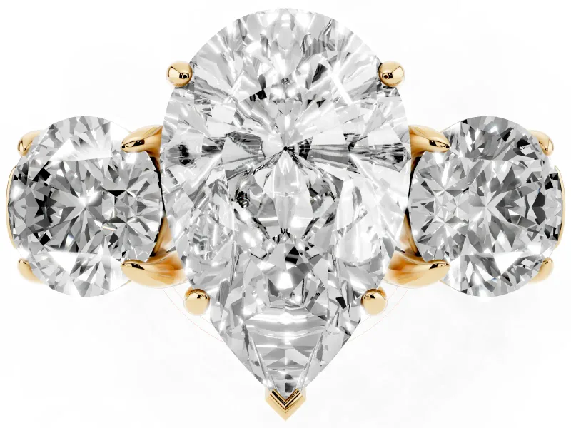 Pear Cut Diamond Three-Stone Ring Set in Yellow gold with Round Accent Stones and Plain Band