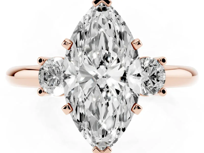 Three-Stone Marquise Cut Diamond Ring Set in Rose gold with Prong Setting and Plain Band