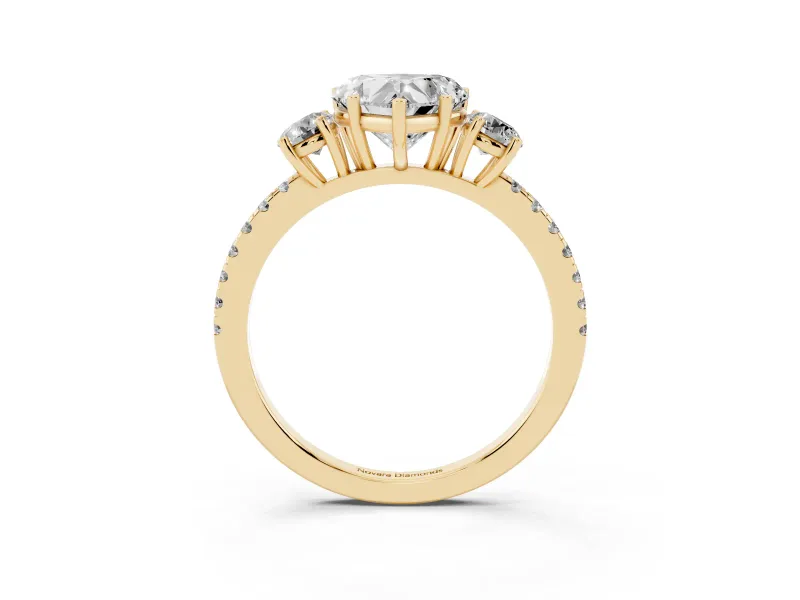 Heart Cut Diamond Three-Stone Ring Set in Yellow gold with Pavé Band and Graduated Sides