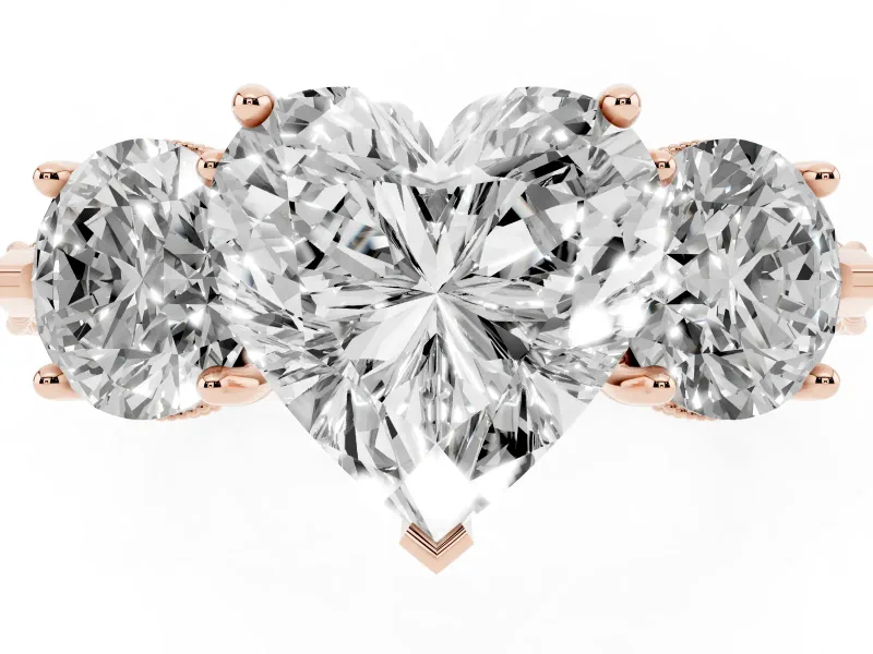 Heart Cut Diamond Three-Stone Ring Set in Rose gold with Milgrain Band