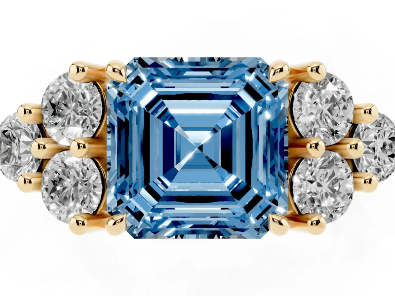 Fancy Blue Asscher Cut Diamond Solitaire Ring Set in Yellow gold with Cluster Accents on Each Side