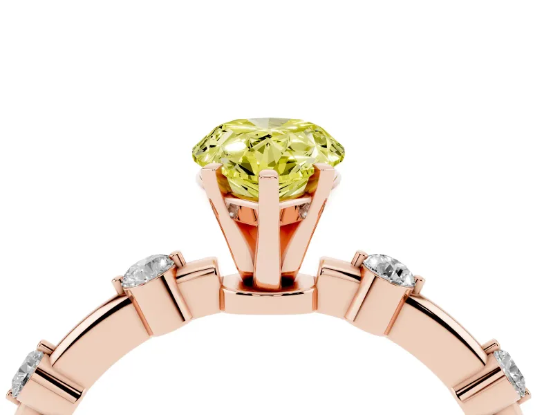 Fancy Yellow Pear Cut Diamond Solitaire Ring Set in Rose gold with Bezel Set Side Stones and Prong Setting