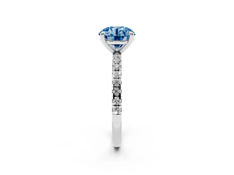 Fancy Blue Round Cut Diamond Brilliant Solitaire Ring Set in Silver with Pavé Band and Prong Setting