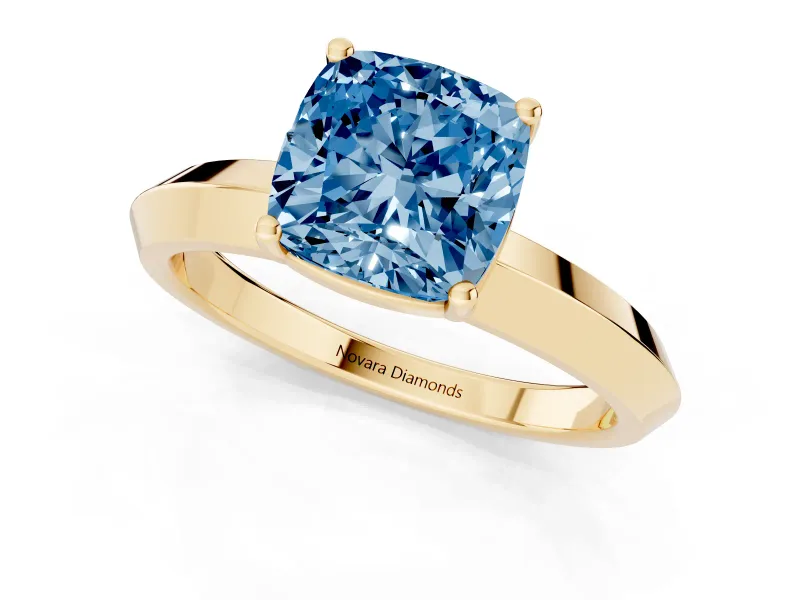 Fancy Blue Cushion Cut Diamond Solitaire Engagement Ring Set in Yellow gold with Flat Band and Prong Setting