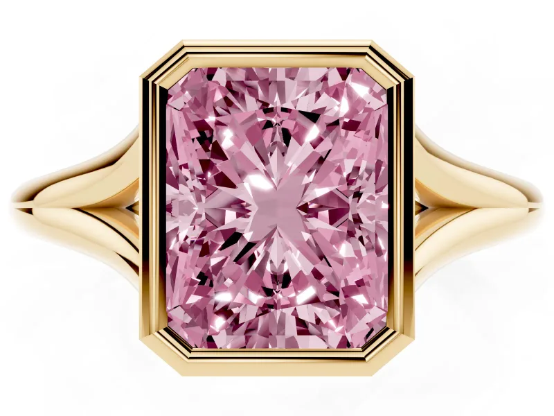Fancy Pink Bezel Set Radiant Cut Diamond Solitaire Ring Set in Yellow gold with Tapered Band