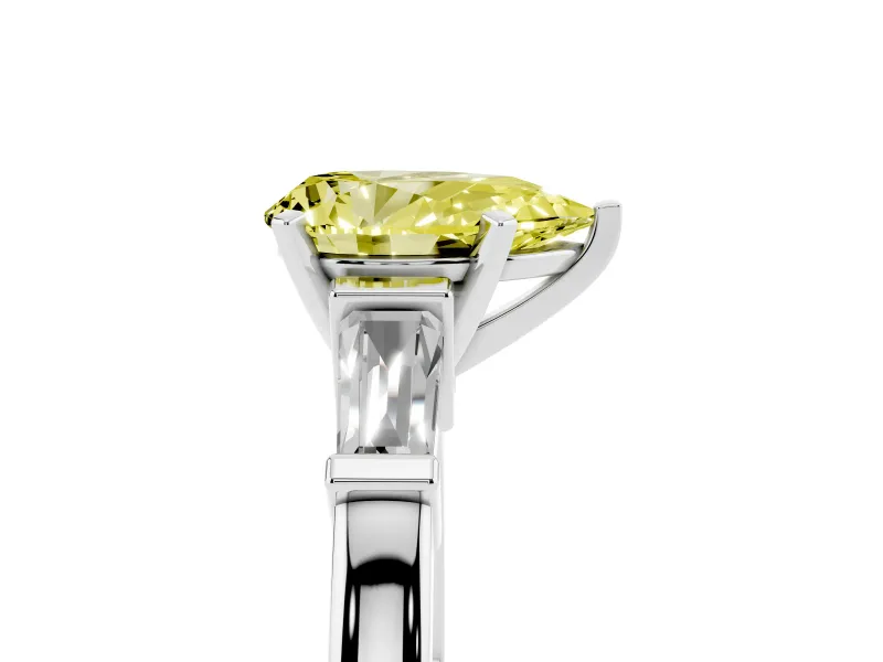 Fancy Yellow Pear Cut Diamond Solitaire Ring Set in Platinum with Tapered Baguette Accents and Prong Setting