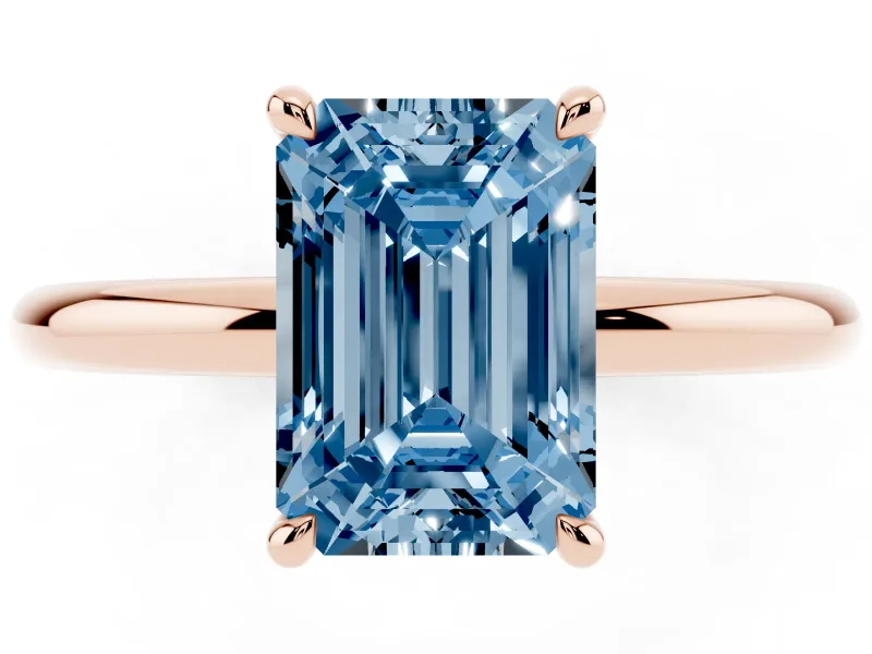 Fancy Blue Emerald Cut Diamond Solitaire Ring Set in Rose gold with Thin Band and Prong Setting