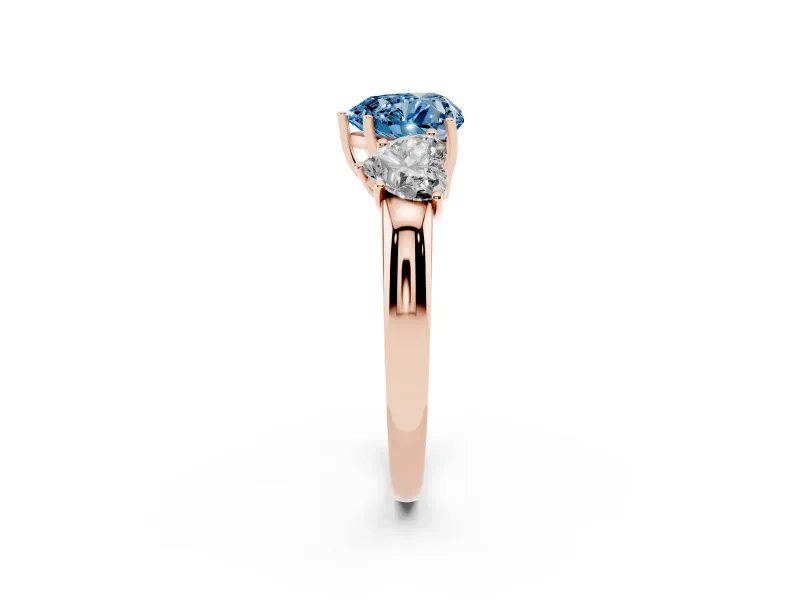 Fancy Blue Heart Cut Diamond Three-Stone Ring Set in Rose gold with Bold Center and Classic Band