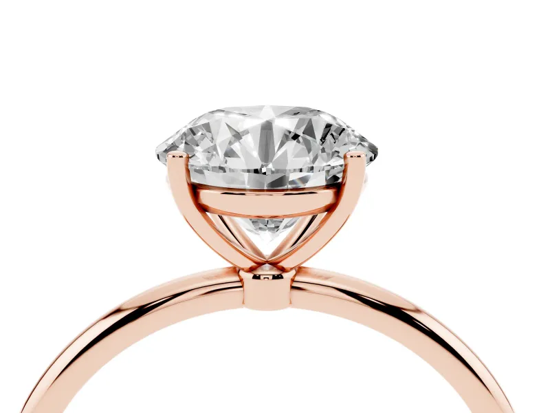 Round Cut Diamond Solitaire Engagement Ring Set in Rose gold with Thin Band and Prong Setting