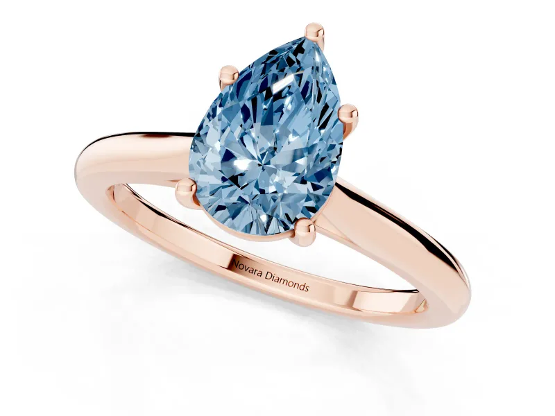 Fancy Blue Pear Cut Diamond Solitaire Ring Set in Rose gold with Cathedral Band and Prong Setting