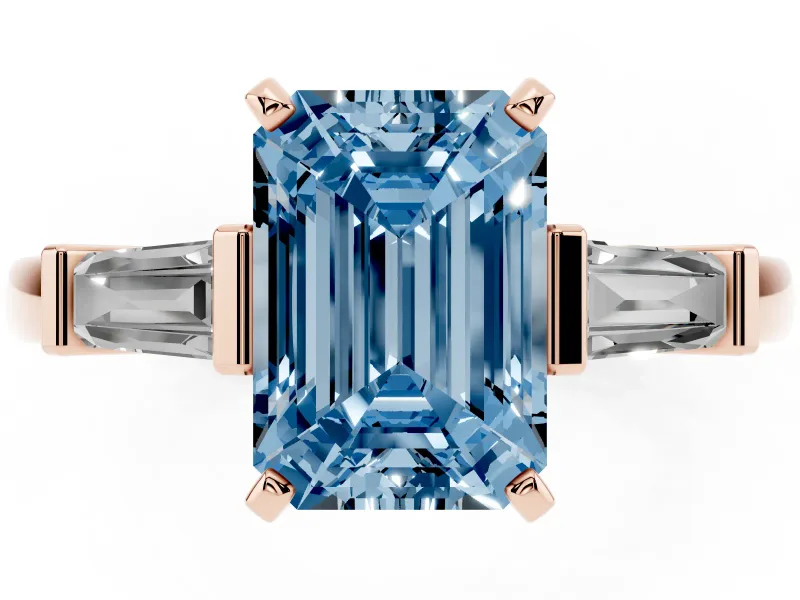 Fancy Blue Emerald Cut Diamond Solitaire Ring Set in Rose gold with Tapered Baguette Accents and Prong Setting