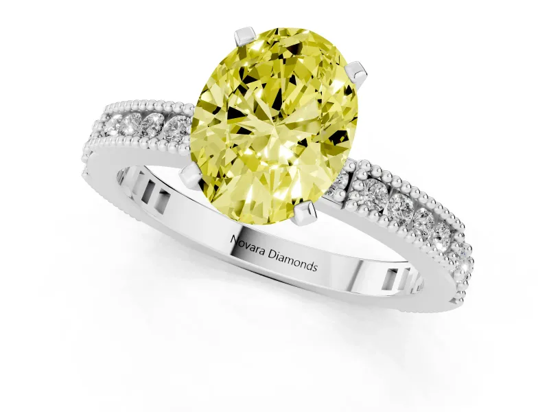 Fancy Yellow Oval Cut Diamond Solitaire Ring Set in Platinum with Slim Pavé Band and Prong Setting
