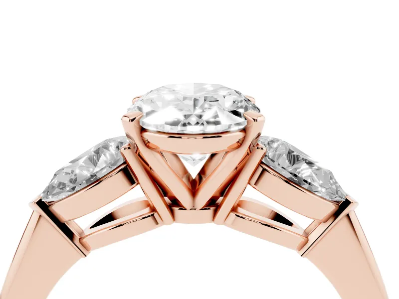 Three-Stone Oval Cut Diamond Ring Set in Rose gold with Pear Side Stones and Prong Setting