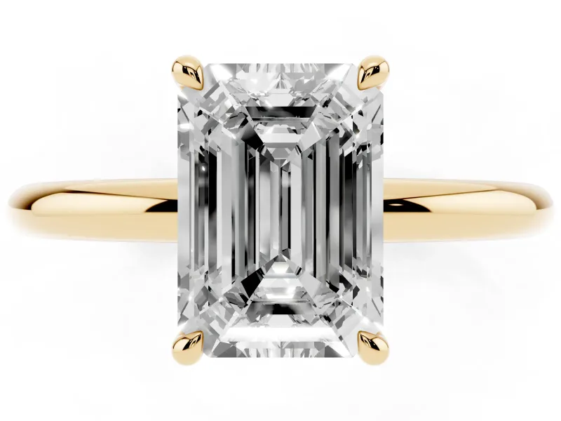Emerald Cut Diamond Solitaire Ring Set in Yellow gold with Thin Band and Prong Setting
