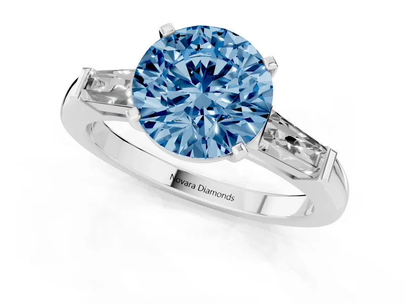 Fancy Blue Round Cut Diamond Solitaire Ring Set in Platinum with Tapered Baguette Side Stones and Prong Setting