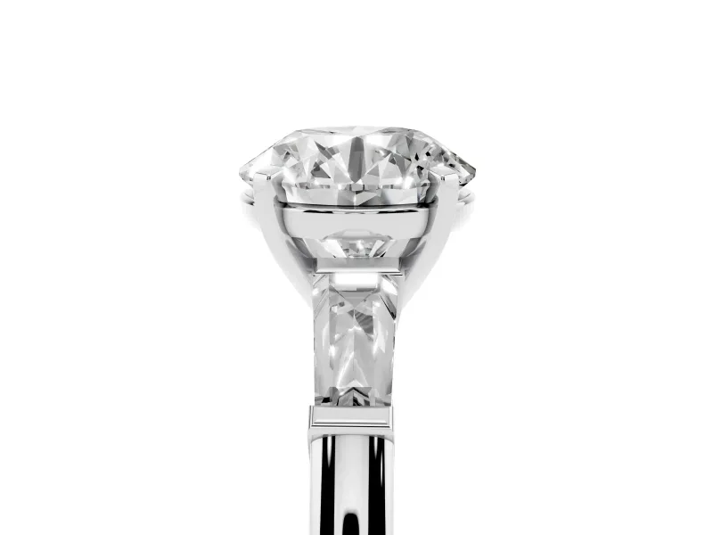 Round Cut Diamond Solitaire Ring Set in Platinum with Tapered Baguette Side Stones and Prong Setting