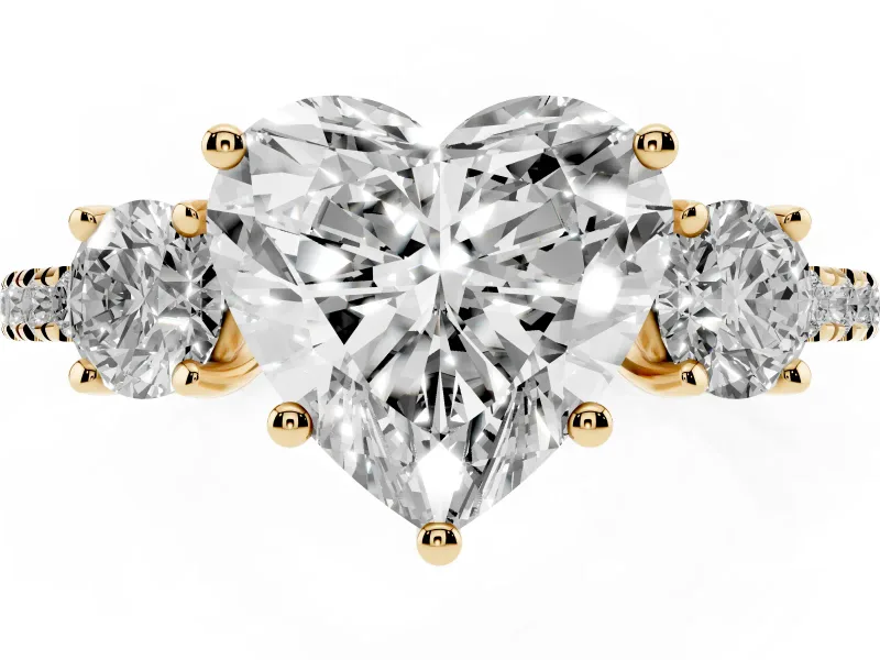 Heart Cut Diamond Three-Stone Ring Set in Yellow gold with Pavé Band and Graduated Sides