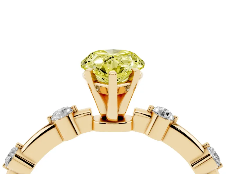 Fancy Yellow Pear Cut Diamond Solitaire Ring Set in Yellow gold with Bezel Set Side Stones and Prong Setting