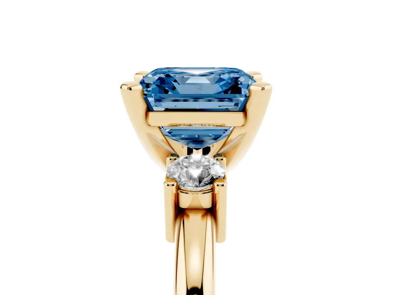 Fancy Blue Three-Stone Asscher Cut Diamond Ring Set in Yellow gold with Prong Setting and Plain Band