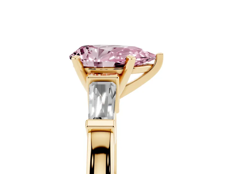 Fancy Pink Pear Cut Diamond Solitaire Ring Set in Yellow gold with Tapered Baguette Accents and Prong Setting