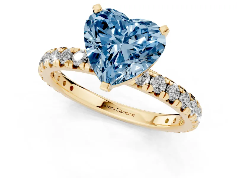 Fancy Blue Heart Cut Diamond Pavé Solitaire Ring Set in Yellow gold with Round Band and Prong Setting