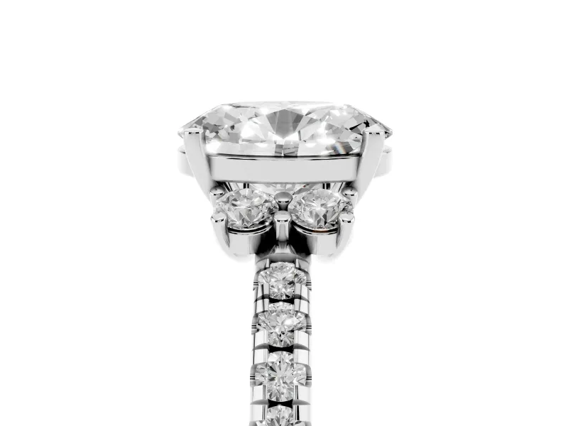 Oval Cut Diamond Three-Stone Pavé Ring Set in Platinum with Prong Setting