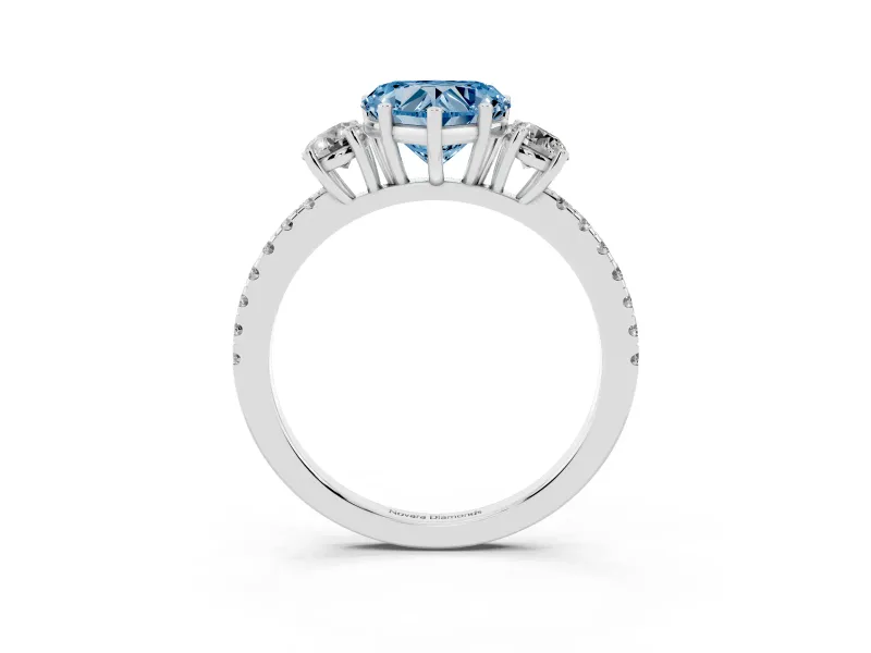 Fancy Blue Heart Cut Diamond Three-Stone Ring Set in Platinum with Pavé Band and Graduated Sides