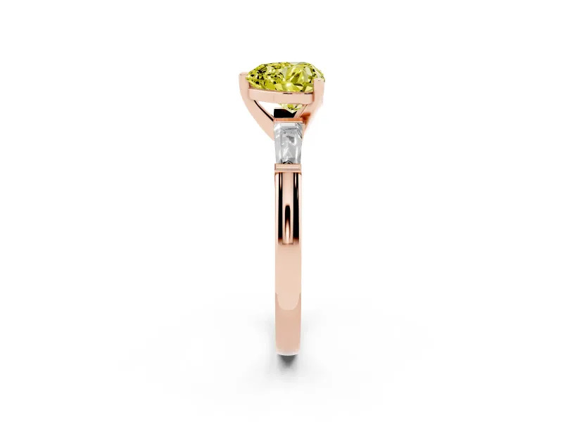 Fancy Yellow Heart Cut Diamond Solitaire Ring Set in Rose gold with Tapered Baguette Side Stones and Prong Setting