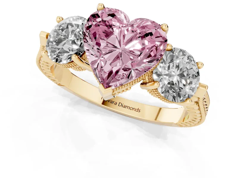 Fancy Pink Heart Cut Diamond Three-Stone Ring Set in Yellow gold with Milgrain Band