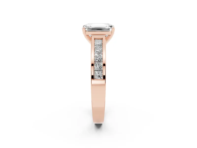 Emerald Cut Diamond Solitaire Ring Set in Rose gold with Channel-Set Band and Prong Setting