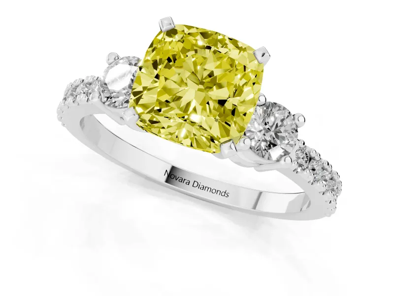 Fancy Yellow Three-Stone Cushion Cut Diamond Pavé Band Ring Set in White gold with Prong Setting
