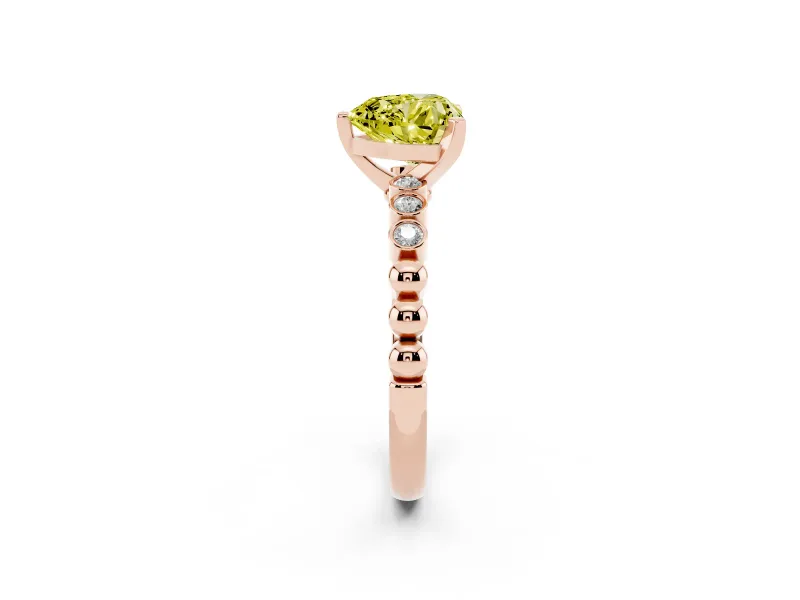 Fancy Yellow Heart Cut Diamond Solitaire Engagement Ring Set in Rose gold with Bezel Accents on Beaded Band