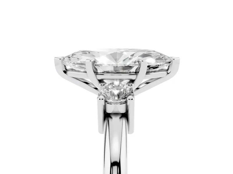 Three-Stone Marquise Cut Diamond Ring Set in White gold with Prong Setting and Plain Band