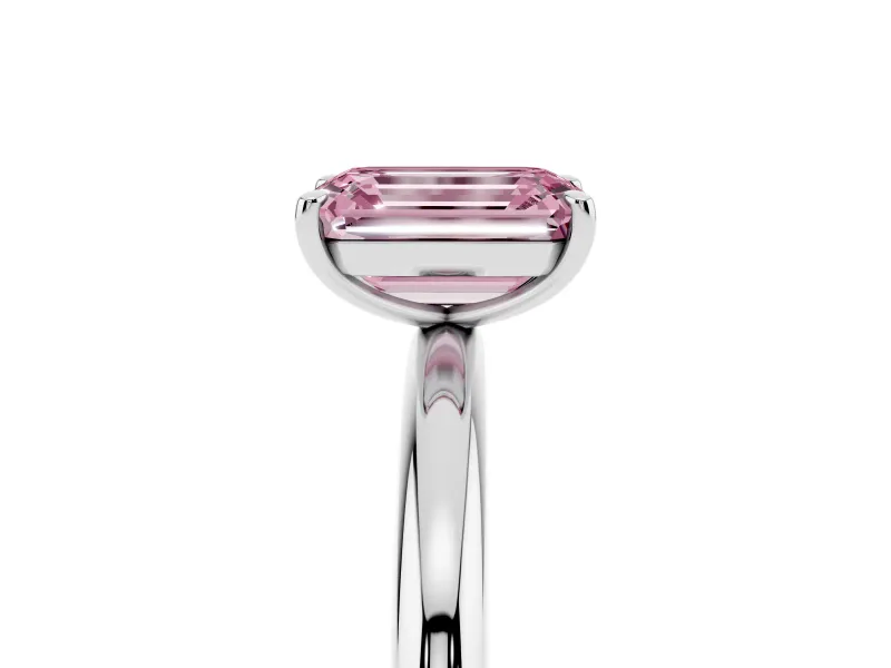 Fancy Pink Emerald Cut Diamond Solitaire Ring Set in Platinum with Prong Setting on a Polished Plain Band