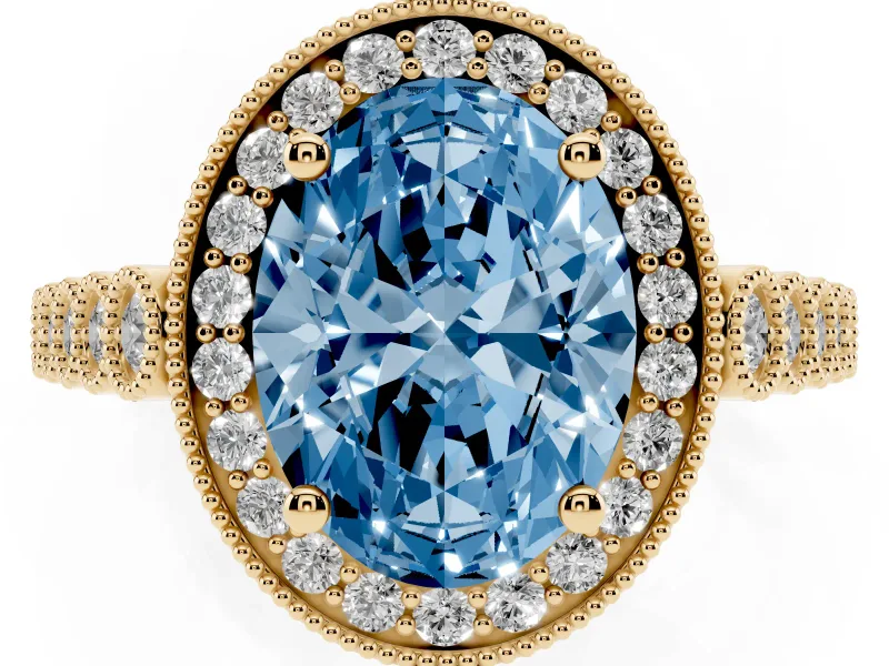 Fancy Blue Oval Cut Diamond Milgrain Halo Solitaire Ring Set in Yellow gold with Bezel Set Side Stones and Pavé Band