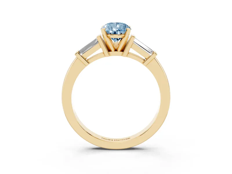 Fancy Blue Pear Cut Diamond Solitaire Ring Set in Yellow gold with Tapered Baguette Accents and Prong Setting