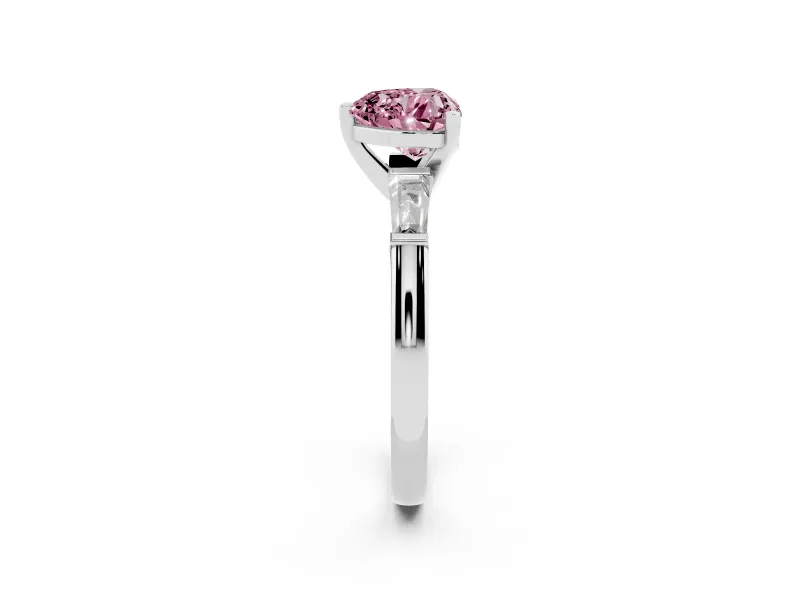 Fancy Pink Heart Cut Diamond Solitaire Ring Set in Platinum with Tapered Baguette Side Stones and Prong Setting